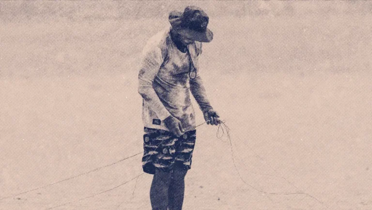 Man untangling Cabrinha kite lines on the beach during a 2-hour private lesson in Kalpitiya.
